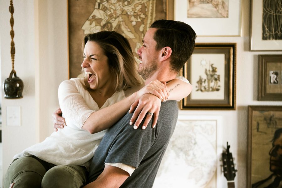 woman being held laughing, Romantic in Home Anniversary Session