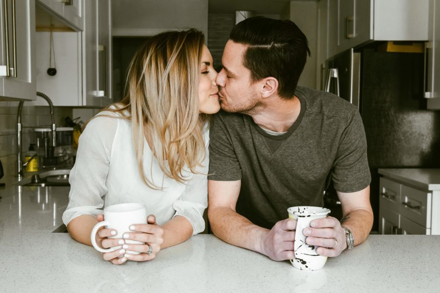 couple kissing over coffee, Romantic in Home Anniversary Session
