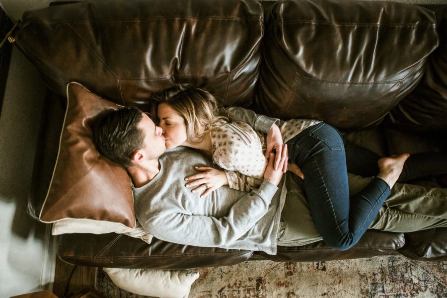 couple laying on couch kissing, Romantic in Home Anniversary Session