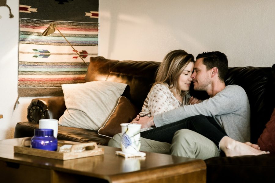 couple hugging on couch, Romantic in Home Anniversary Session