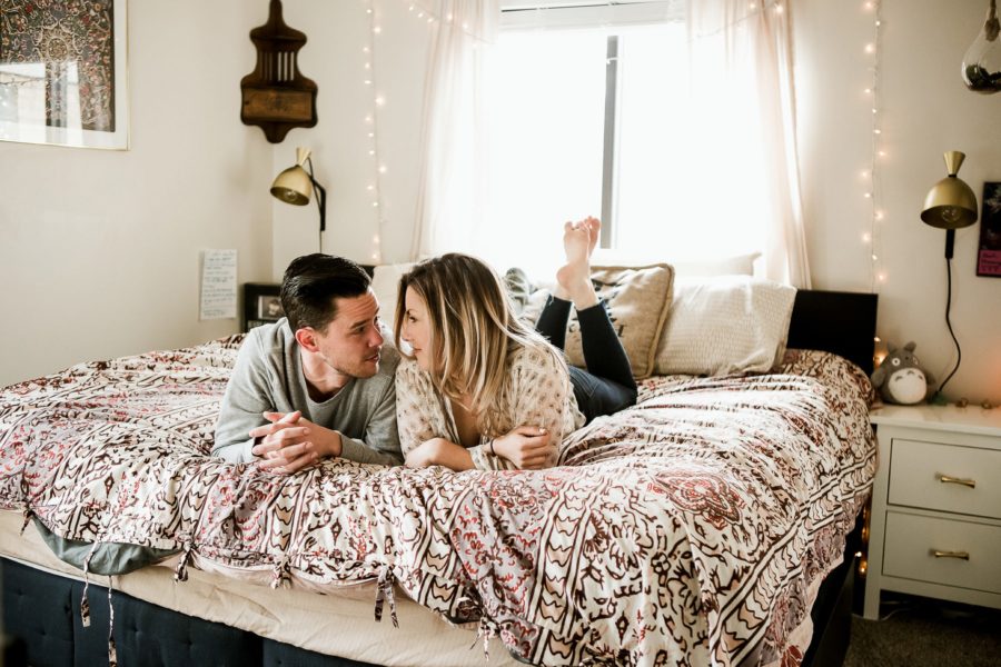 couple laughing on bed, Romantic in Home Anniversary Session