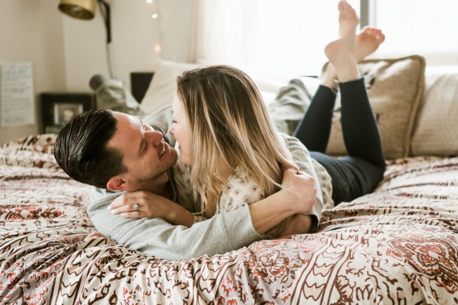 husband and wife cuddling on bed, Romantic in Home Anniversary Session