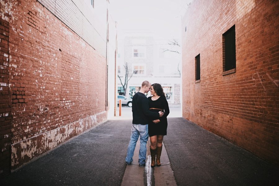 couple hugging for maternity, Downtown Alley Maternity Session in Colorado 