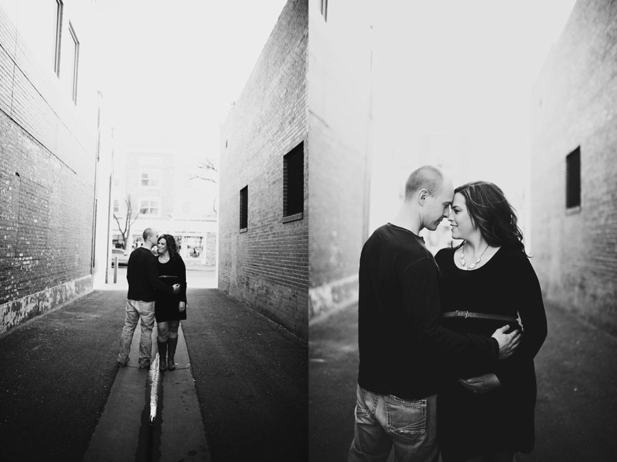 couple kissing for maternity, Downtown Alley Maternity Session in Colorado 