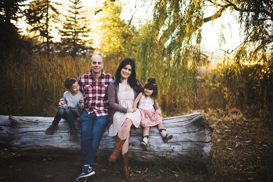 family of 4 poses for sitting down, Sunset Family Pictures in Colorado