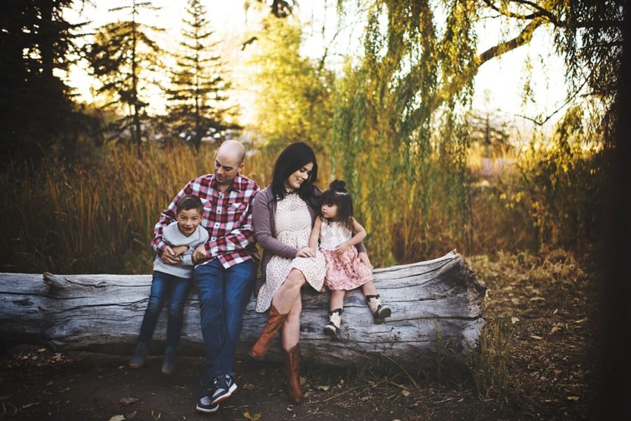 family of 4 poses for sitting down, Sunset Family Pictures in Colorado