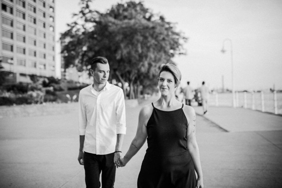 couple walking down boardwalk, Urban Couple Session in Downtown Ontario 