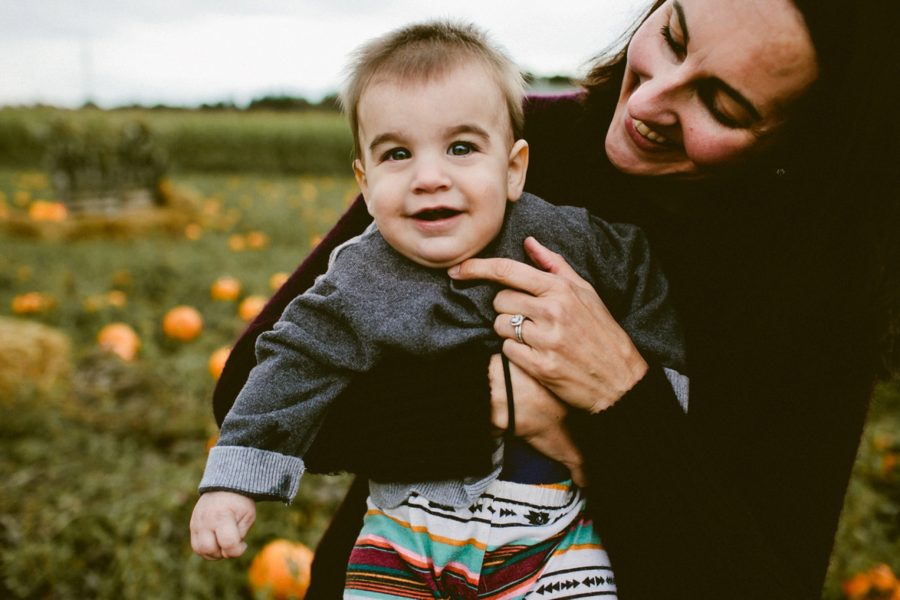 mom holding son, lifestyle photography, Family Pumpkin Patch Adventure in British Columbia