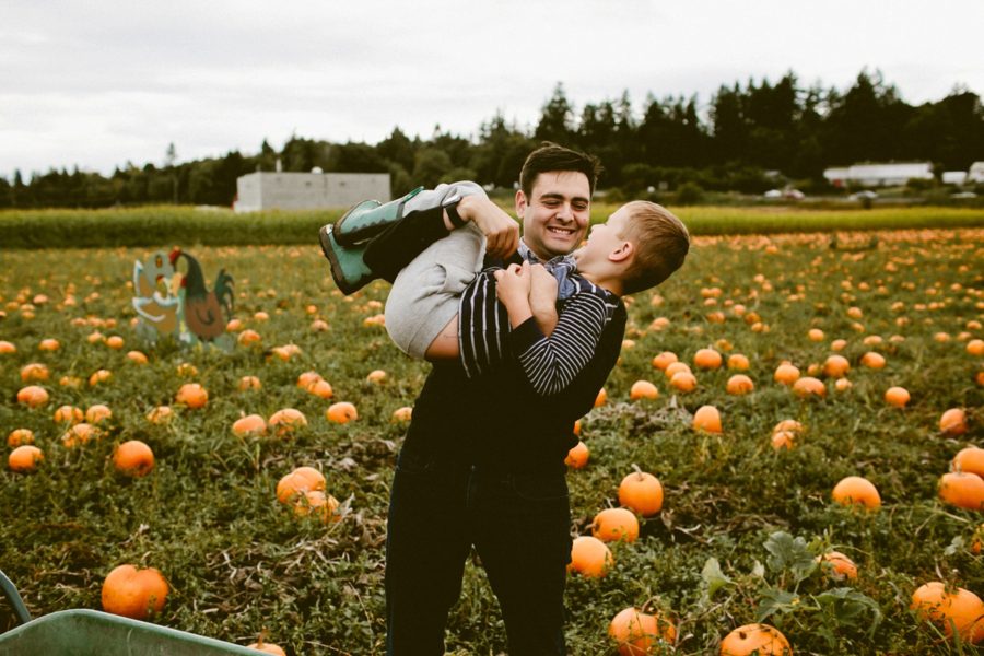 dad holding son, lifestyle photography, Family Pumpkin Patch Adventure in British Columbia