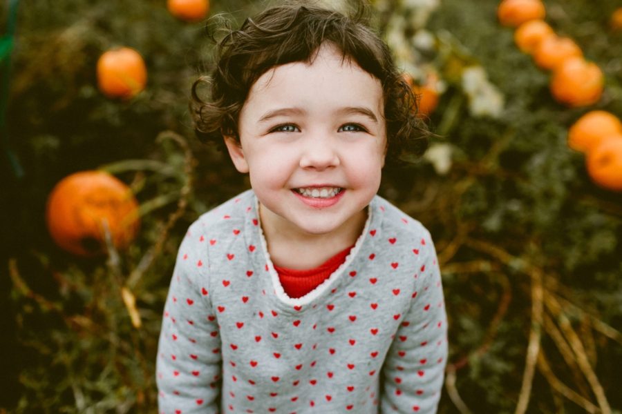 little girl at pumpkin patch, lifestyle photography, Family Pumpkin Patch Adventure in British Columbia