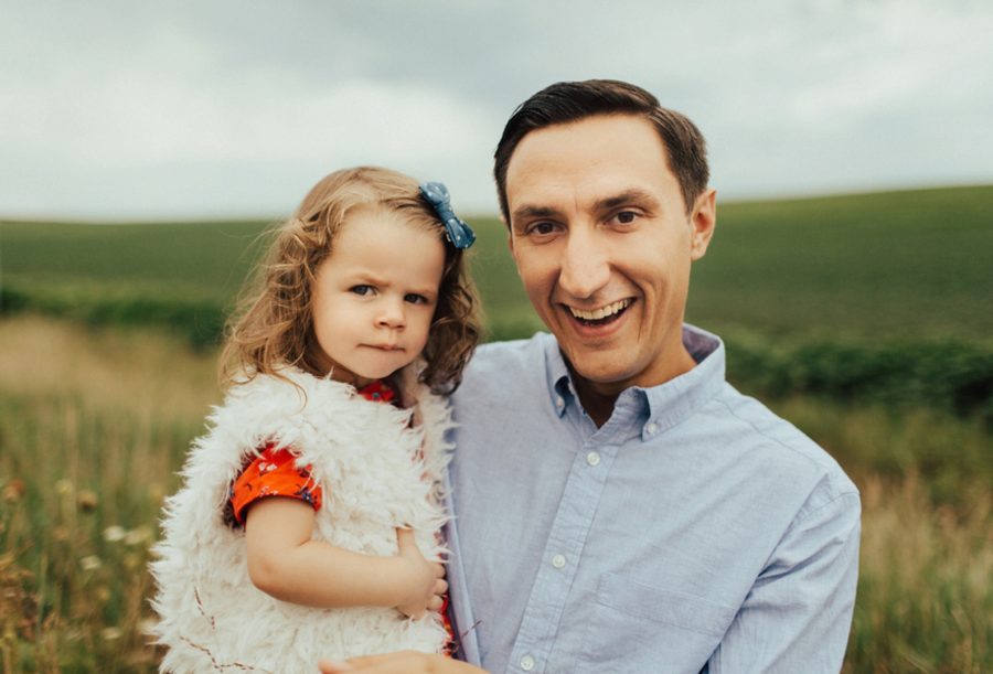 dad holding daughter, Boho Fall Family of 4 Pictures in Iowa