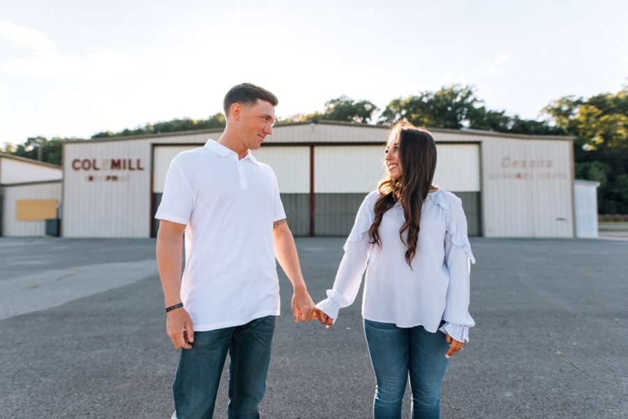 couple smiling at each other, Abandoned Airport Engagement Pictures in Nashville