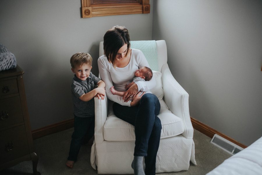 mom with baby, big brother with newborn, In-home newborn adoption lifestyle pictures 