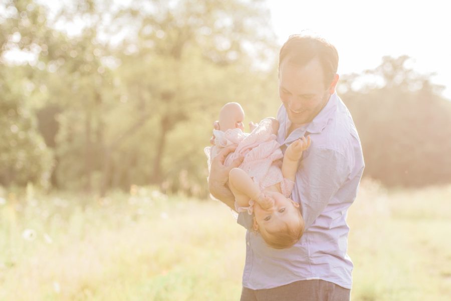 Father holding daughter, Sunlit portrait, Light-Drenched Family Portraits in Wisconsin