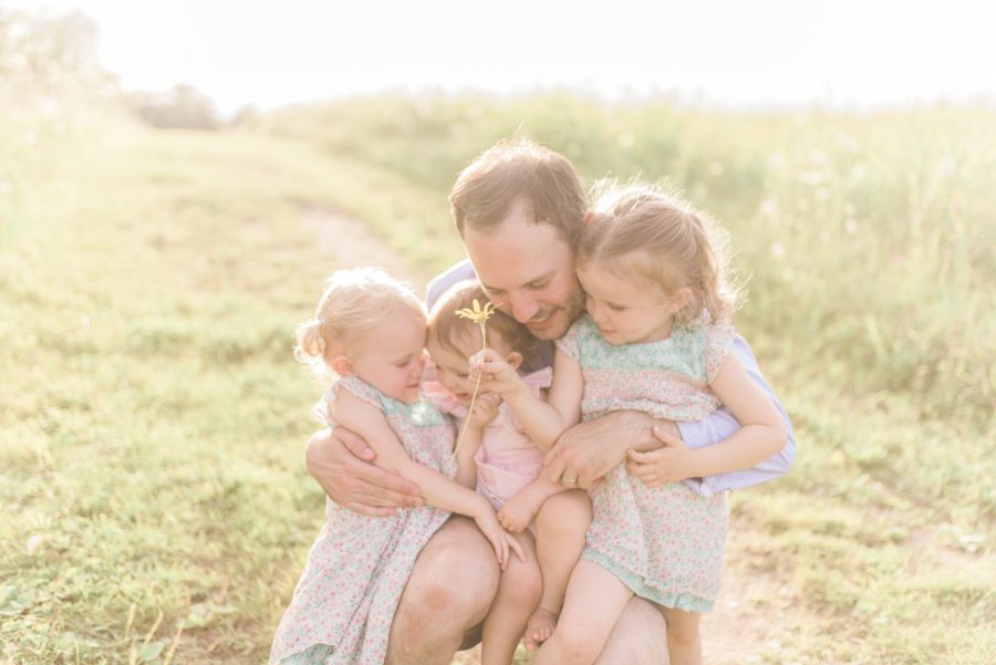 Daddy with daughters, Outdoor family session posing, Light-Drenched Family Portraits in Wisconsin