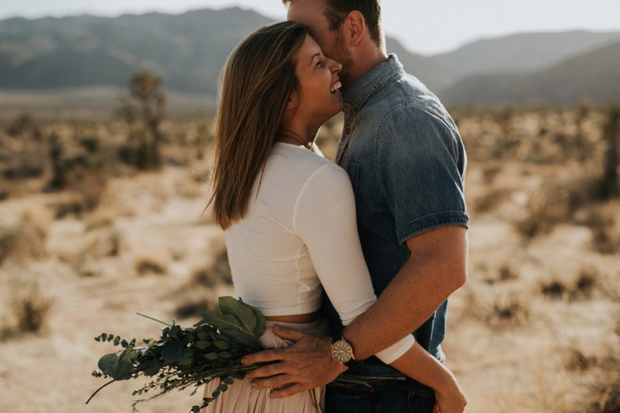 woman laughing with man, Moody Couples Session at Joshua Tree