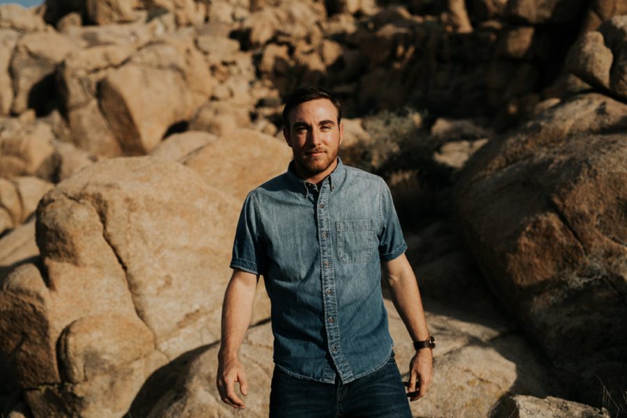portrait of man outdoors, boulders, Moody Couples Session at Joshua Tree