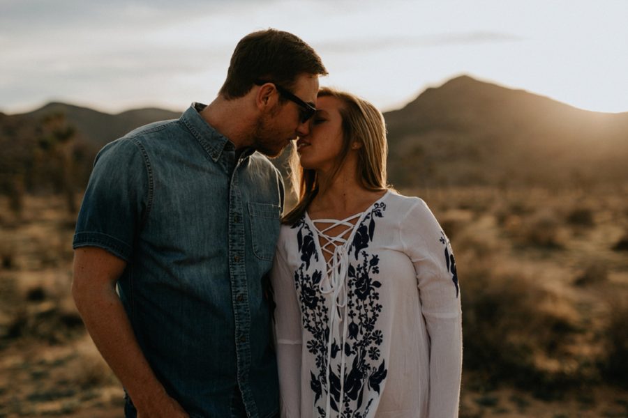 Couple almost kissing, desert engagement, Moody Couples Session at Joshua Tree