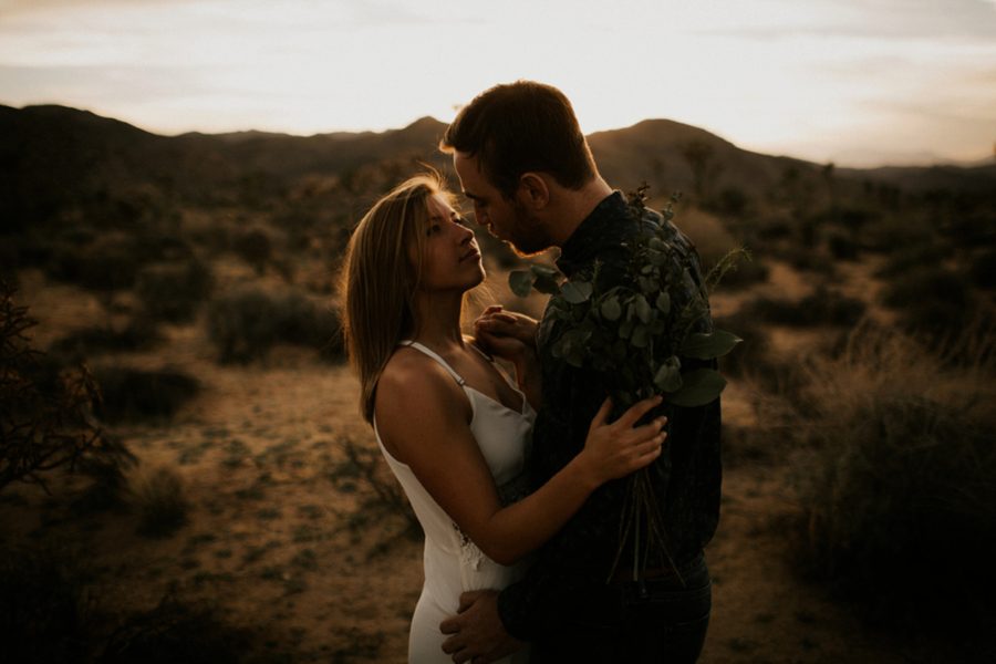 intimate engagement pose, leaf bouquet for styled shoot, Moody Couples Session at Joshua Tree