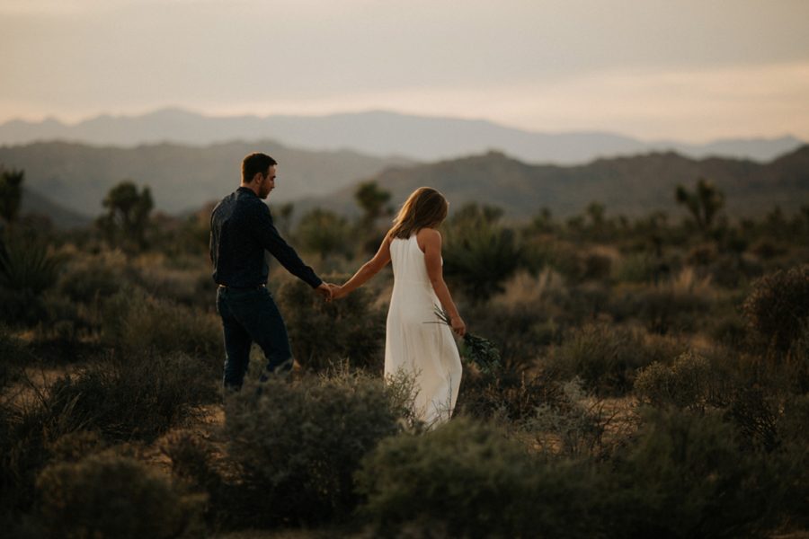 man and woman walking in desert, Moody Couples Session at Joshua Tree