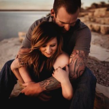 man sitting behind woman with arms wrapped around her, Daily Fan Favorite