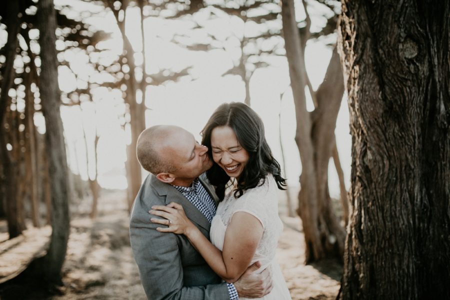 couple laughing during engagement photos, San Francisco Beach Engagement Photos