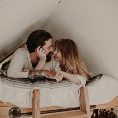 Couple on loft bed in tiny house, Lifestyle photos of couple in tiny home, Couples Lifestyle Session in North Carolina Tiny House