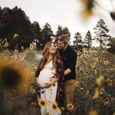 Couple posing in sunflower field, Outdoor Maternity Inspiration, Maternity picture ideas, Moody Sunflower Maternity Session in Colorado