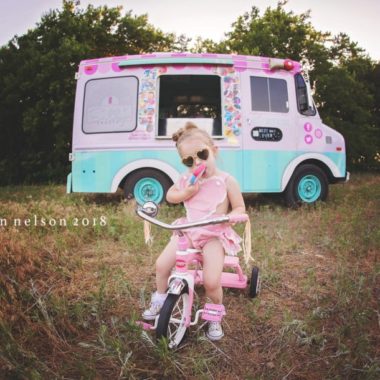 Girl eating popsicle in front of ice cream truck, Meagan Nelson Photography Daily Fan Favorite