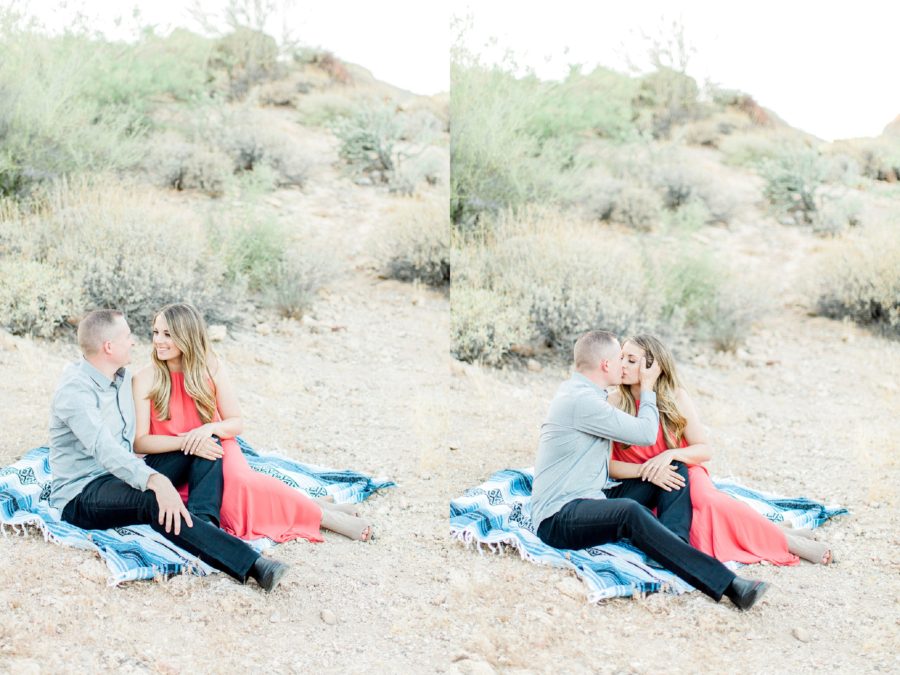 Couple sitting on blanket together smiling and kissing, Canyon Lake Engagement Pictures in Arizona