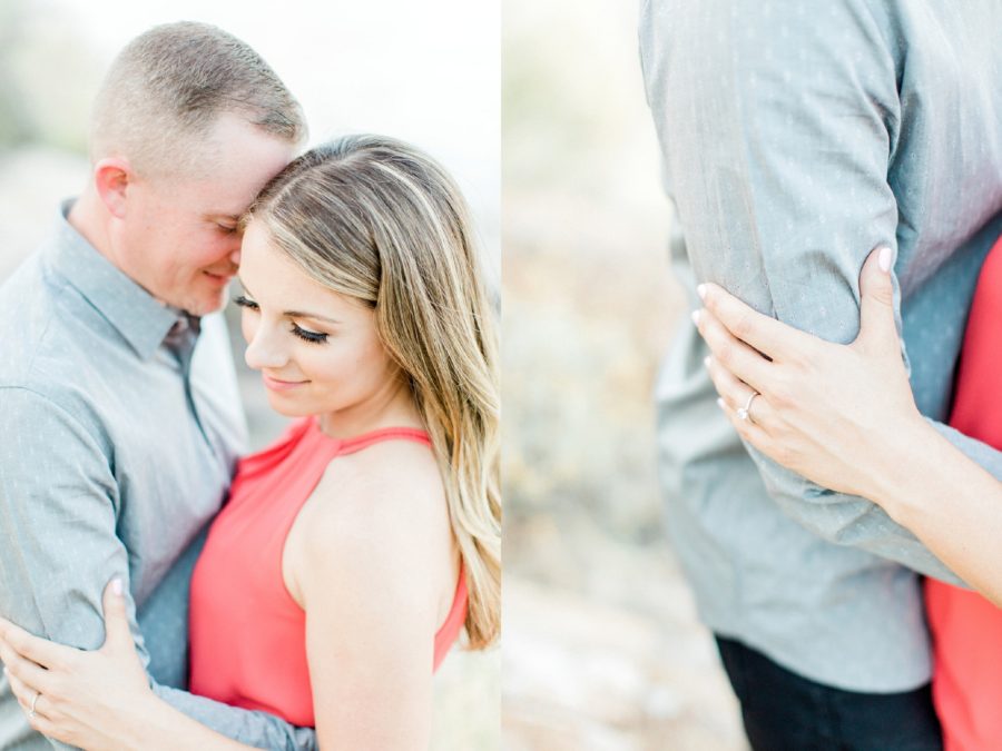 Couple snuggling during engagement photos, Woman grasping finances arm, Canyon Lake Engagement Pictures in Arizona