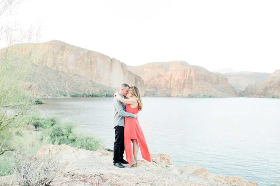 Couple touching foreheads, coral dress for engagement photos, Canyon Lake Engagement Pictures in Arizona