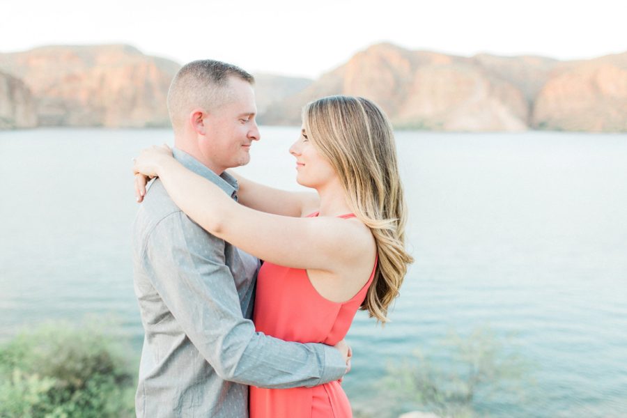 Couple looking in to each others eyes with arms wrapped around each other, Canyon Lake Engagement Pictures in Arizona