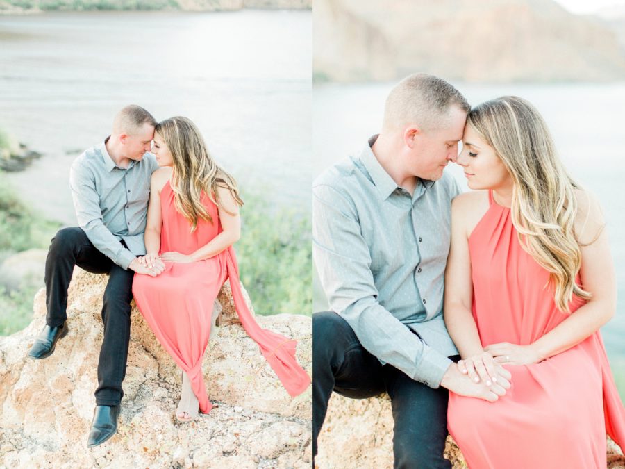 Couple sitting on rocks high above water, Canyon Lake Engagement Pictures in Arizona