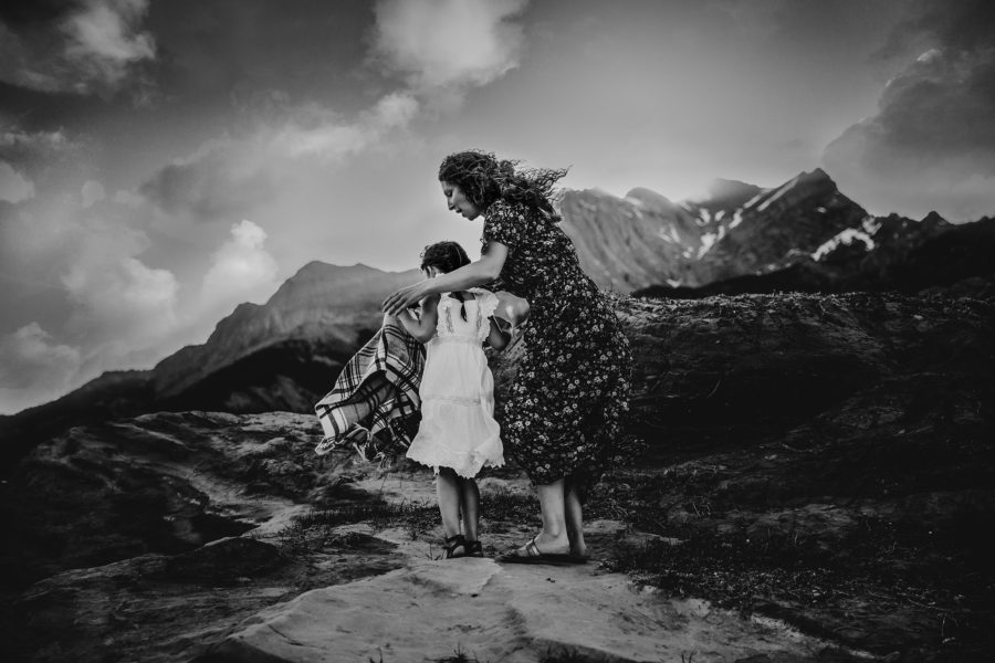 Woman and child walking with mountains in background, Daily Fan Favorite Bree Friesen Photography