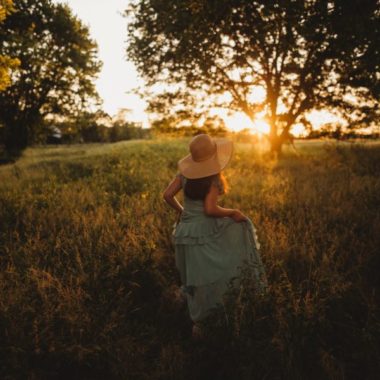 Girl walking through field at sundown, Heather Marshall Photography Daily Fan Favorite