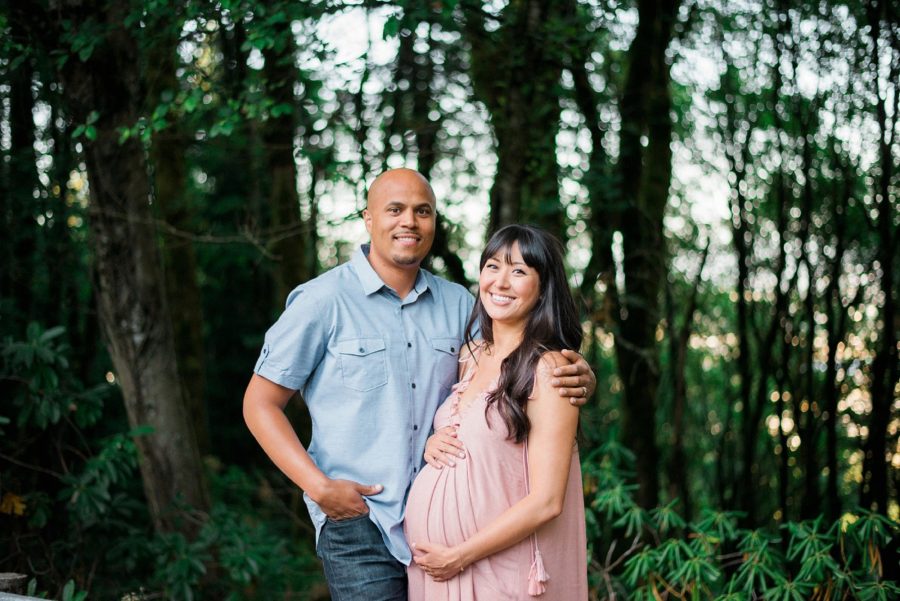 Man and woman smiling and posing for maternity pictures, Pittock Mansion Gardens Maternity Session