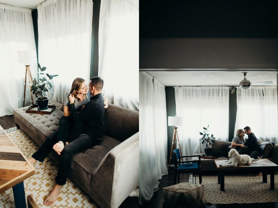 Man and woman holding each other on couch, In-Home Couples Session to Announce Adoption