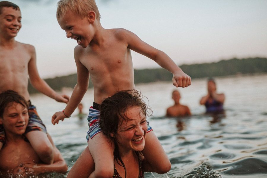 Kids on shoulders in lake, Casey Hurley Photography Daily Fan Favorite