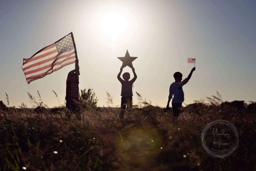 Silhouettes holding american flag, Beyond the Wanderlust Daily Fan Favorites