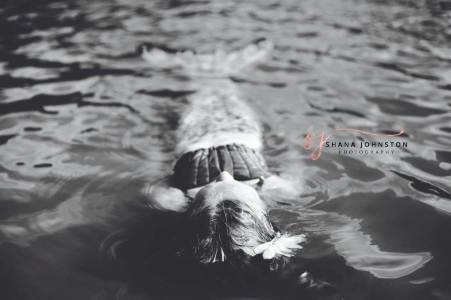 black and white photo of girl dressed as mermaid in water, Beyond the Wanderlust Daily Fan Favorite