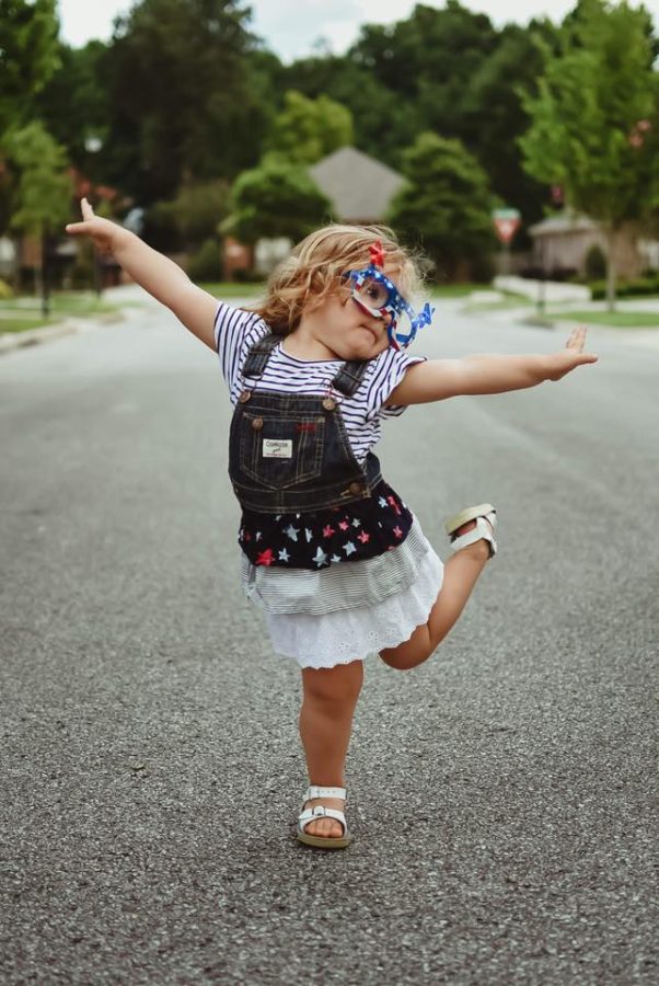 Toddler posing with leg up dressed for fourth of july, Beyond the Wanderlust Daily Fan Favorite