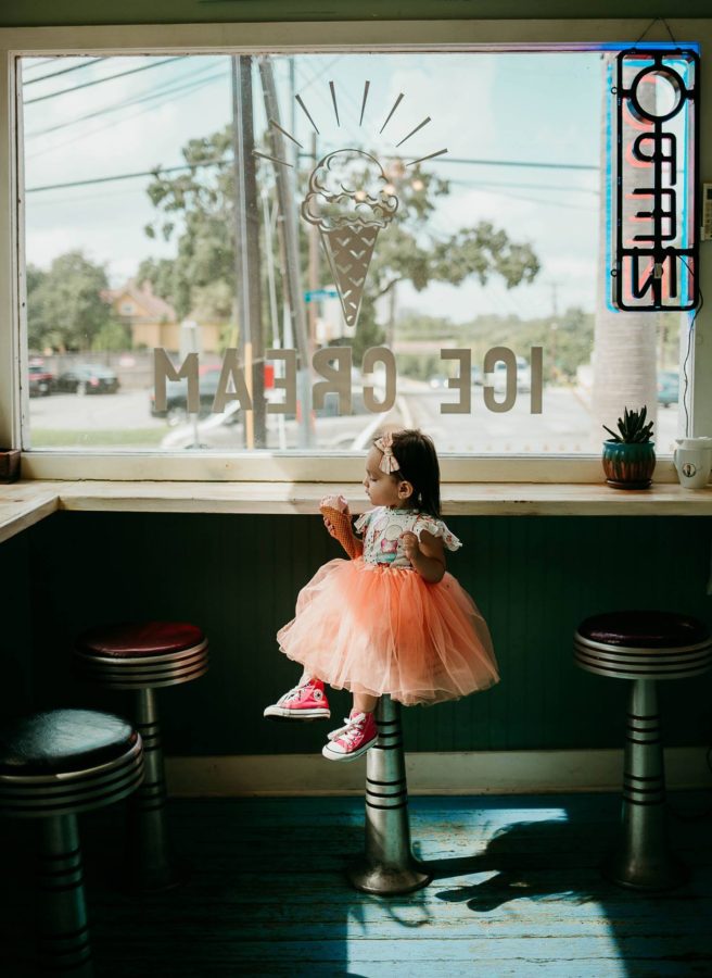 Toddler sitting on bar stool in ice cream shop, Rae Vision Photography Daily Fan Favorite