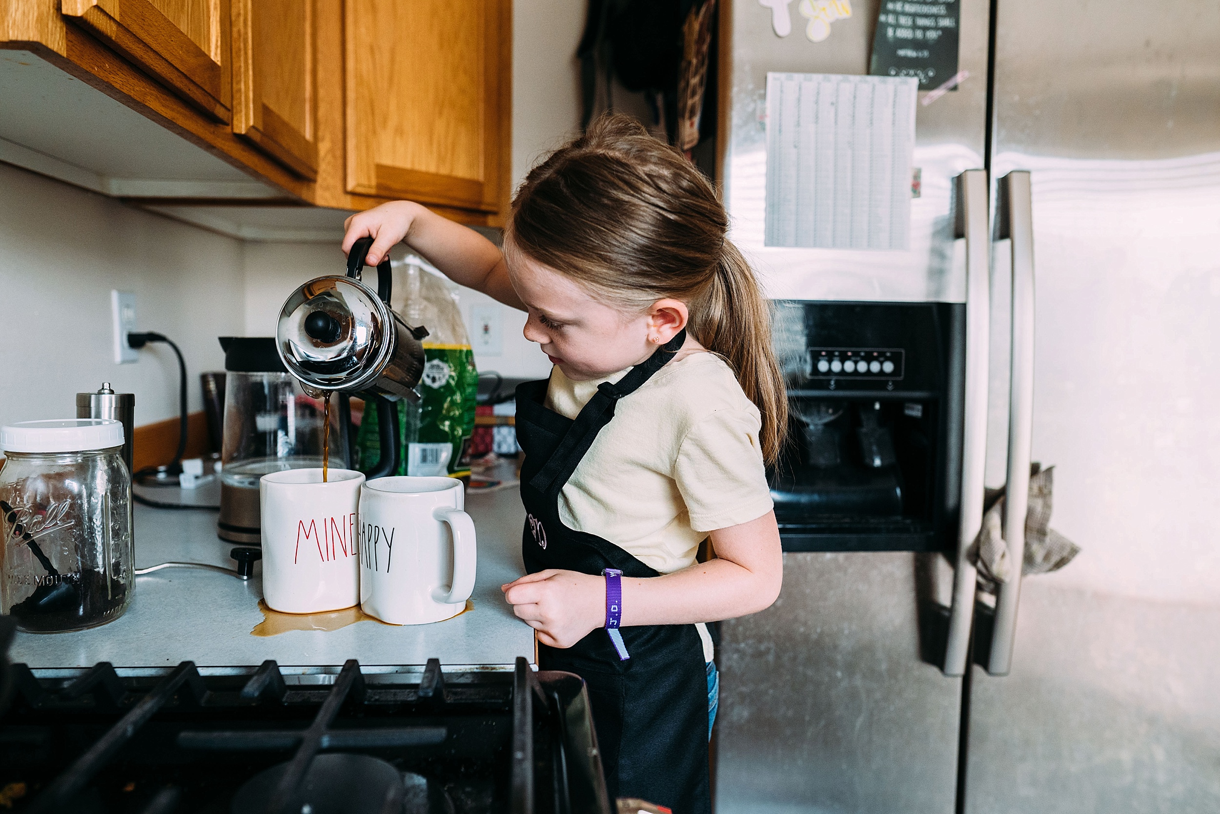 lifestyle and documentary photography, little girl pouring coffee for mom, family photography