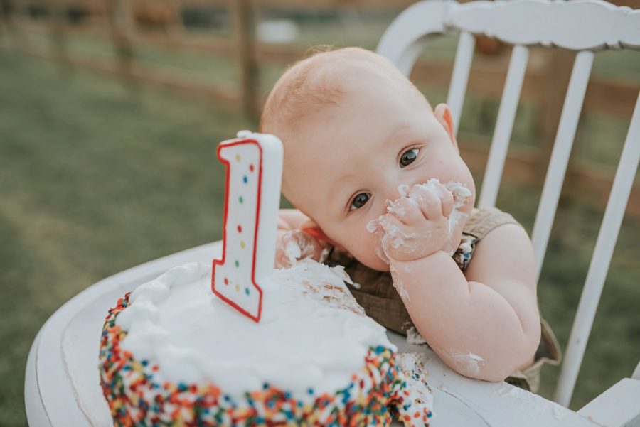 First birthday pictures, little kid on farm, little boy with smash cake in vintage chair, rainbow confetti cake